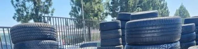 Lee Tire wet yard rows of used tires